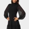 bebe2152_black_2_42bb2224-467b-42ce-98f9-7b6384445971 Long Sleeve Mock Neck Chifon Smocked Mini Dress